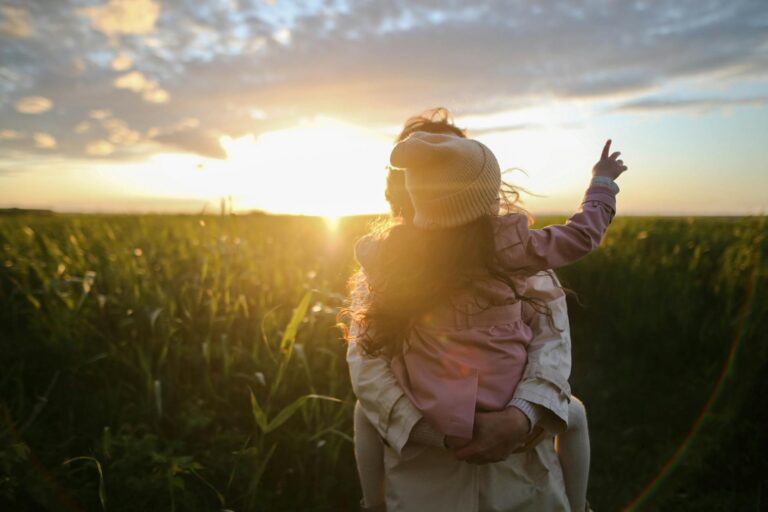 mother and daughter on grass